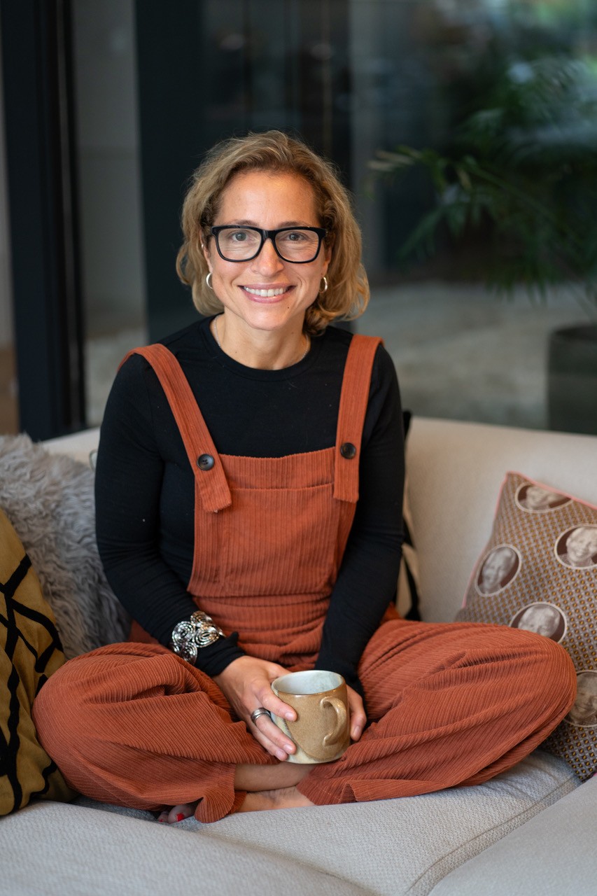 Buffy cross-legged on the sofa